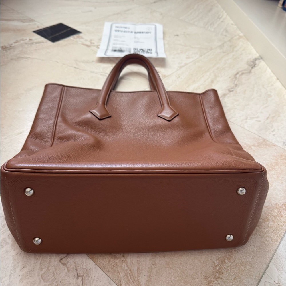 Hermes Tan Leather Tote Bag
Approx 16.5” high X 6”deep X 13” wide 6” strap drop - Picture 3 of 10